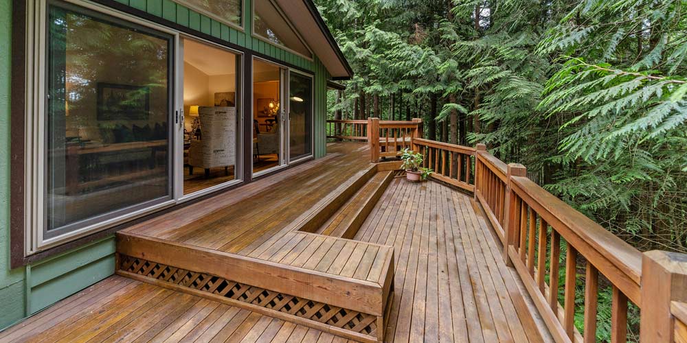 Soft washing is a better choice for cleaning decks & vinyl surfaces.