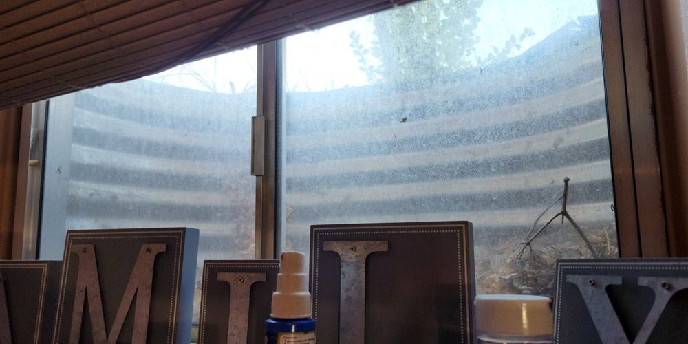 Using baking soda to clean hard water stains on windows has been successful.