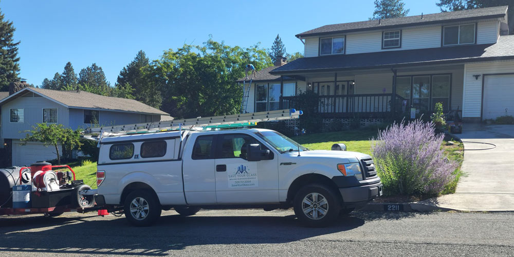 Using professional window cleaners can safely remove hard water stains off your home's windows.